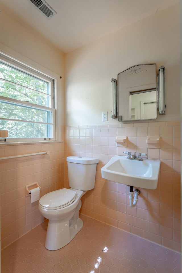 1613 Fairy Dell Trl, Lookout Mountain, GA 30750 - bathroom with a sink, toilet, tile walls, tile patterned floors, and wainscoting