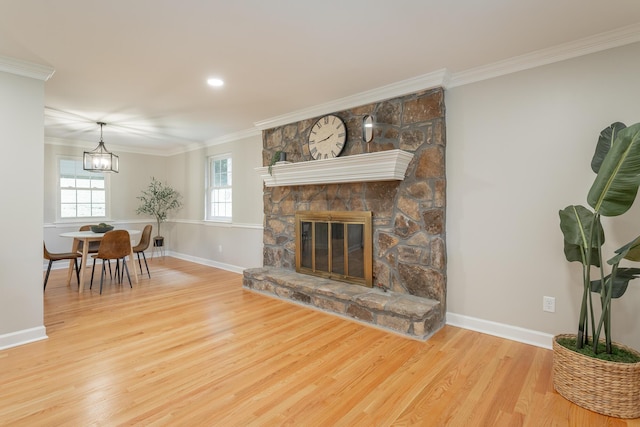 5873 Old Dayton Pike, Chattanooga, TN 37415 - living area featuring baseboards, wood finished floors, crown molding, a chandelier, and a stone fireplace