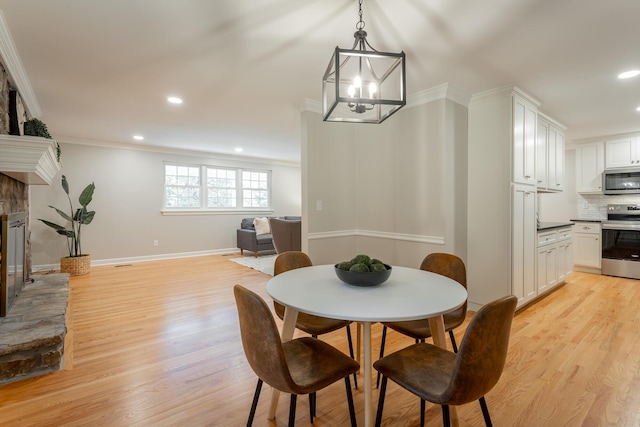 5873 Old Dayton Pike, Chattanooga, TN 37415 - dining area with light wood-type flooring, recessed lighting, a glass covered fireplace, ornamental molding, and baseboards