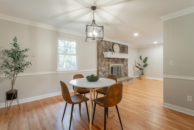 5873 Old Dayton Pike, Chattanooga, TN 37415 - dining room with a chandelier, light wood-type flooring, baseboards, ornamental molding, and a stone fireplace