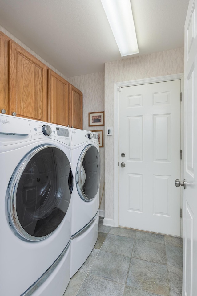 6245 Heritage Ridge Dr, Hixson, TN 37343 - washroom with cabinet space, washing machine and clothes dryer, wallpapered walls, and baseboards
