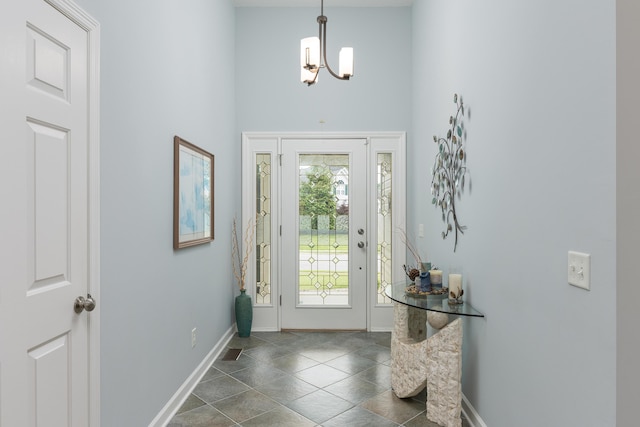 6245 Heritage Ridge Dr, Hixson, TN 37343 - foyer entrance featuring baseboards, a high ceiling, and a chandelier