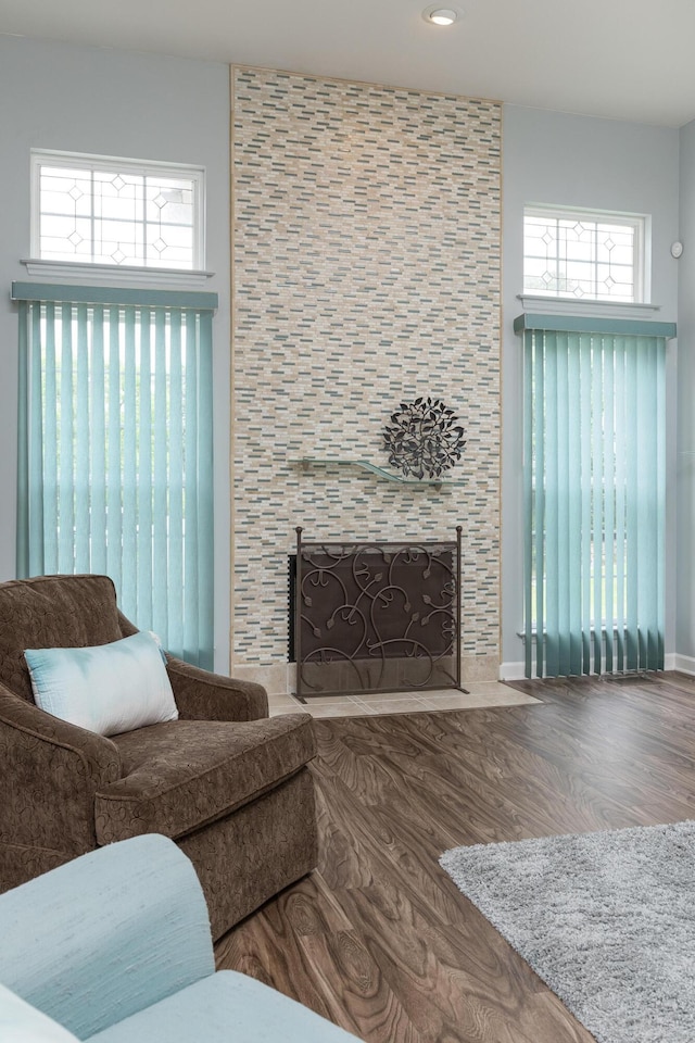 6245 Heritage Ridge Dr, Hixson, TN 37343 - living room featuring a tiled fireplace, healthy amount of natural light, wood finished floors, and recessed lighting