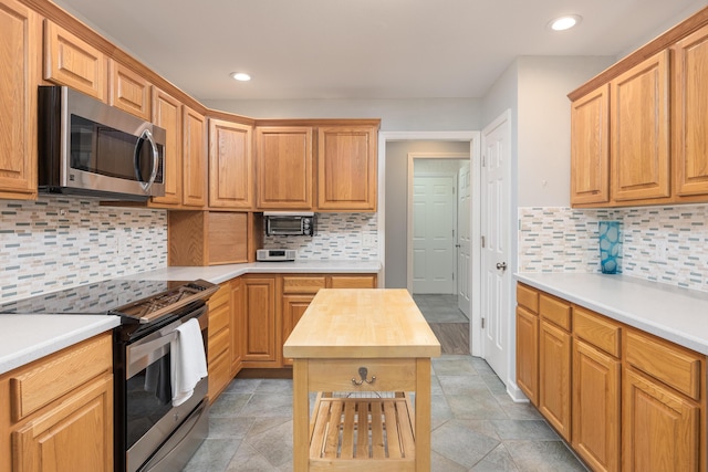 6245 Heritage Ridge Dr, Hixson, TN 37343 - kitchen with stainless steel appliances, recessed lighting, decorative backsplash, wooden counters, and light stone finish flooring