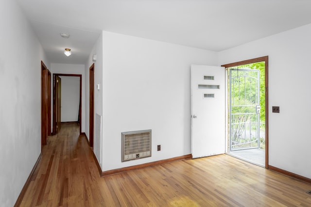 7750 Vista Hills Dr, Chattanooga, TN 37416 - empty room featuring heating unit, wood finished floors, baseboards, and a smoke detector