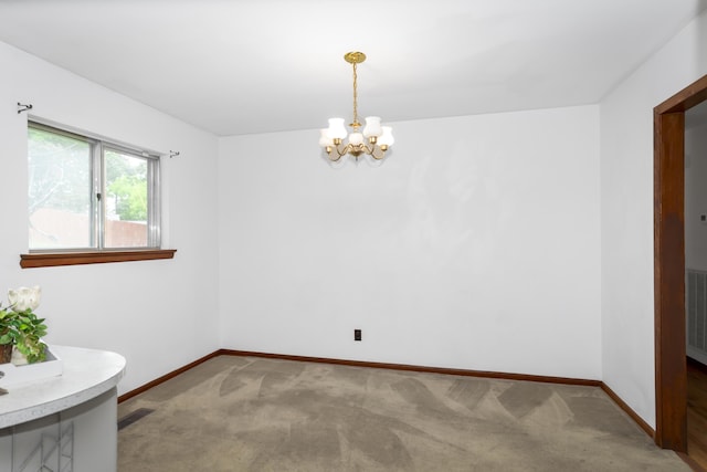 7750 Vista Hills Dr, Chattanooga, TN 37416 - empty room with a chandelier, baseboards, and carpet flooring