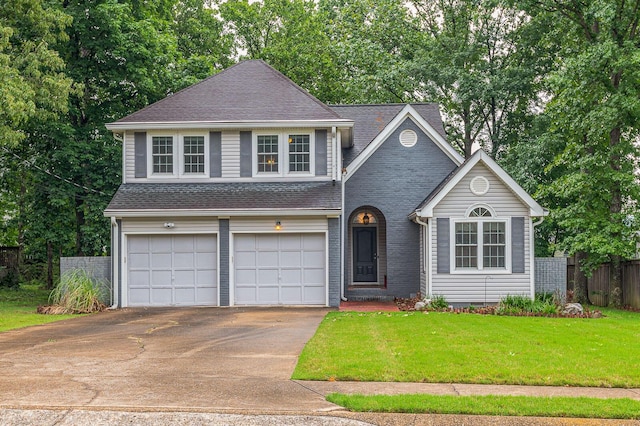 2418 Charleston Sq, Chattanooga, TN 37421 - view of front of home featuring concrete driveway, a garage, a shingled roof, view of scattered trees, and brick siding