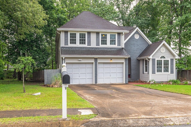 2418 Charleston Sq, Chattanooga, TN 37421 - traditional-style house with driveway, roof with shingles, and an attached garage
