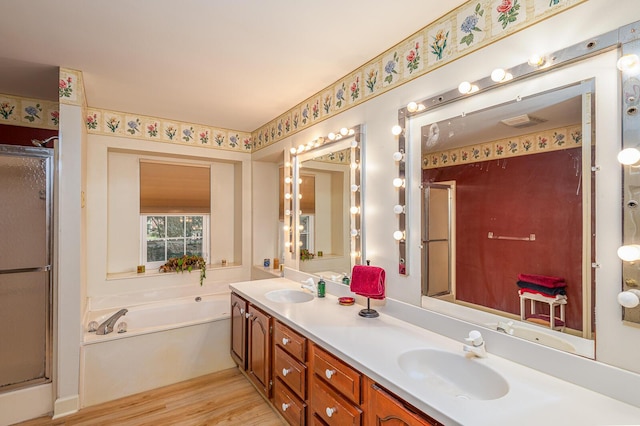 2418 Charleston Sq, Chattanooga, TN 37421 - bathroom with a bath, a shower stall, double vanity, and wood finished floors
