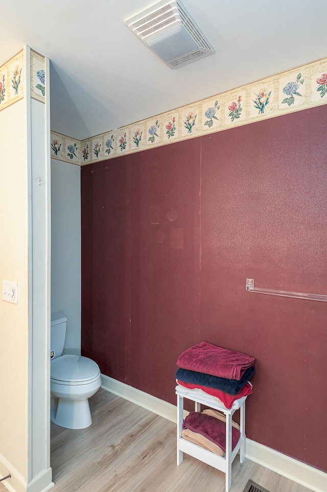 2418 Charleston Sq, Chattanooga, TN 37421 - bathroom with wood finished floors, toilet, and baseboards