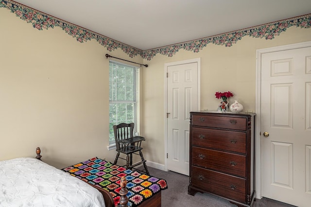2418 Charleston Sq, Chattanooga, TN 37421 - bedroom with dark colored carpet and baseboards