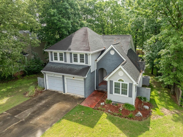 2418 Charleston Sq, Chattanooga, TN 37421 - traditional-style home with roof with shingles, driveway, a front yard, and an attached garage