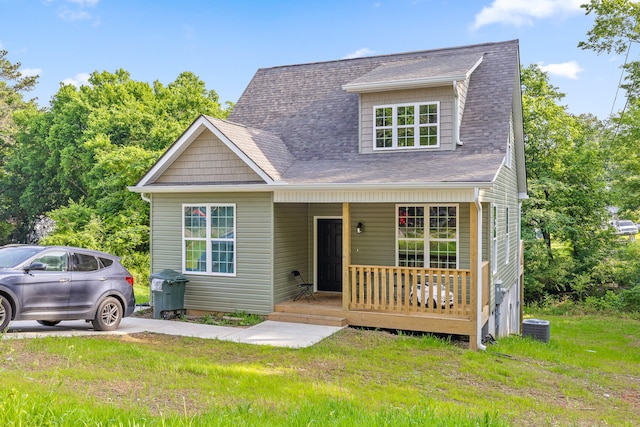 6219 Walden Ave, Chattanooga, TN 37421 - view of front of house with a porch, a front lawn, central AC unit, and roof with shingles
