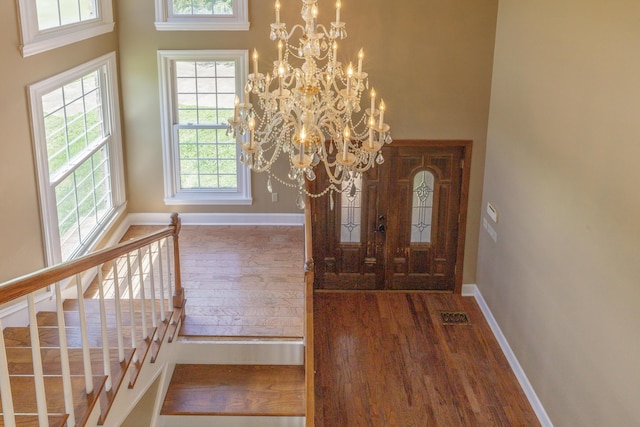 7902 Ooltewah Georgetown Rd, Ooltewah, TN 37363 - entrance foyer featuring wood finished floors, stairway, a high ceiling, and baseboards
