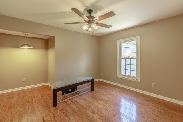 7902 Ooltewah Georgetown Rd, Ooltewah, TN 37363 - unfurnished room with light wood finished floors, ceiling fan, and baseboards