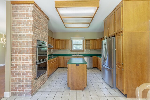 7902 Ooltewah Georgetown Rd, Ooltewah, TN 37363 - kitchen featuring appliances with stainless steel finishes, a sink, a kitchen island, open shelves, and light tile patterned flooring
