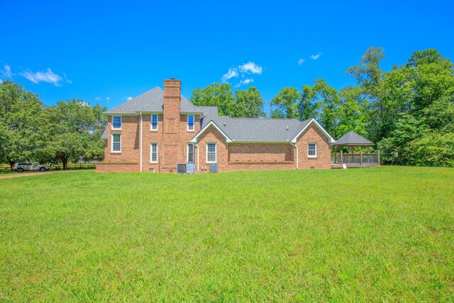 7902 Ooltewah Georgetown Rd, Ooltewah, TN 37363 - rear view of property with a lawn, brick siding, a chimney, a gazebo, and roof with shingles