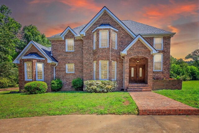 7902 Ooltewah Georgetown Rd, Ooltewah, TN 37363 - traditional home featuring a front yard, brick siding, and a shingled roof