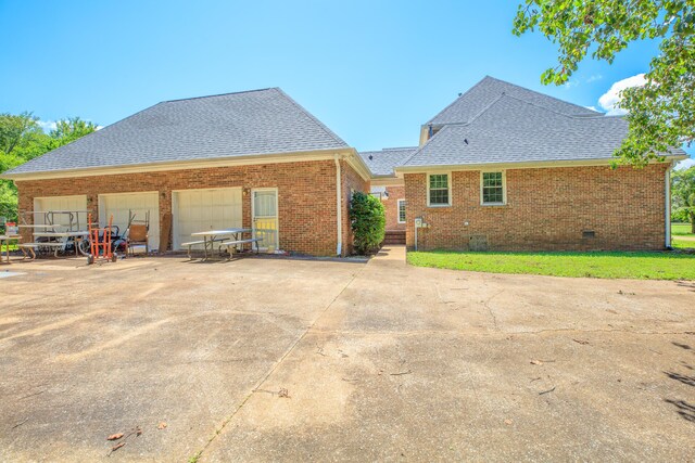 7902 Ooltewah Georgetown Rd, Ooltewah, TN 37363 - back of property featuring a shingled roof, brick siding, driveway, and crawl space