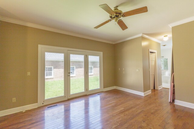 7902 Ooltewah Georgetown Rd, Ooltewah, TN 37363 - unfurnished room with wood finished floors, ornamental molding, a ceiling fan, and baseboards