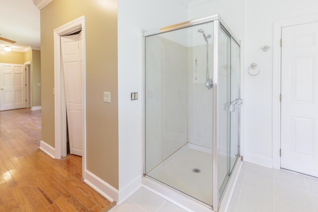 7902 Ooltewah Georgetown Rd, Ooltewah, TN 37363 - full bath featuring crown molding, a stall shower, wood finished floors, and baseboards