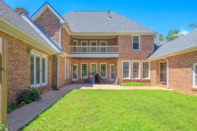 7902 Ooltewah Georgetown Rd, Ooltewah, TN 37363 - rear view of property with french doors, a yard, a shingled roof, brick siding, and a balcony