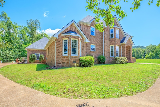 7902 Ooltewah Georgetown Rd, Ooltewah, TN 37363 - view of front facade with brick siding, crawl space, and a front lawn
