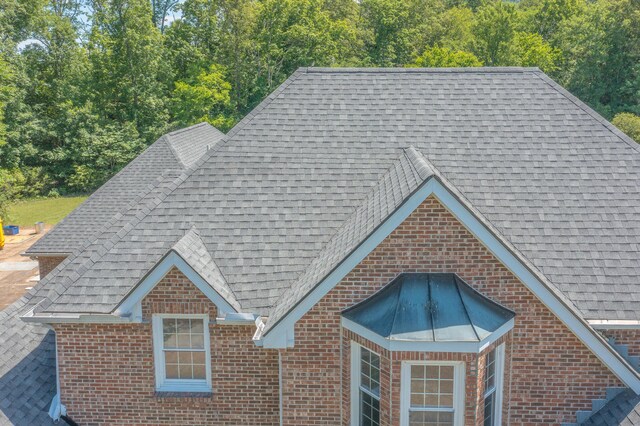 7902 Ooltewah Georgetown Rd, Ooltewah, TN 37363 - exterior view of a shingled roof and brick siding
