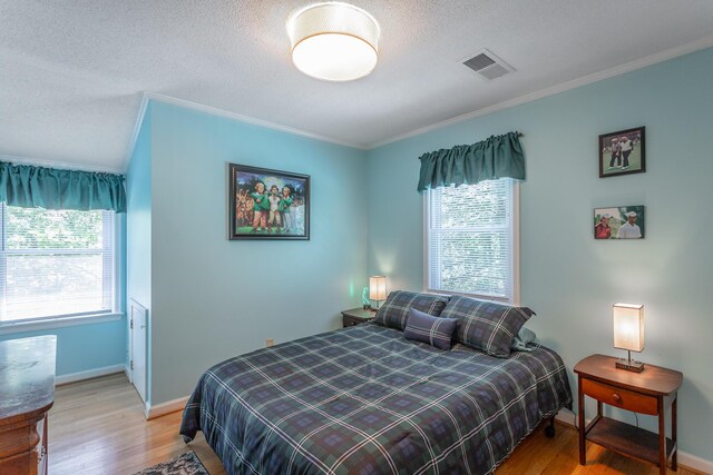 821 Ravine Rd, Signal Mountain, TN 37377 - bedroom with ornamental molding, wood finished floors, a textured ceiling, and baseboards