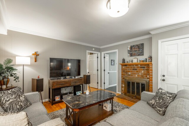 821 Ravine Rd, Signal Mountain, TN 37377 - living room with crown molding, light wood-style flooring, a fireplace, and baseboards