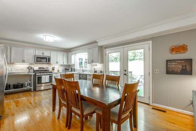 821 Ravine Rd, Signal Mountain, TN 37377 - dining space featuring crown molding, light wood-type flooring, and french doors