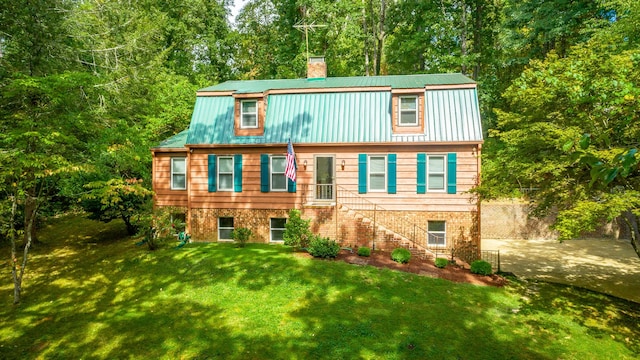 821 Ravine Rd, Signal Mountain, TN 37377 - view of front of house with a chimney, stairway, metal roof, and a front lawn