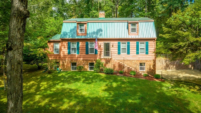 821 Ravine Rd, Signal Mountain, TN 37377 - view of front facade featuring a chimney, metal roof, a front yard, and stairs