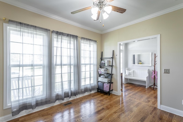 7531 Nightfall Cir, Ooltewah, TN 37363 - unfurnished room featuring crown molding, wood finished floors, a ceiling fan, and baseboards