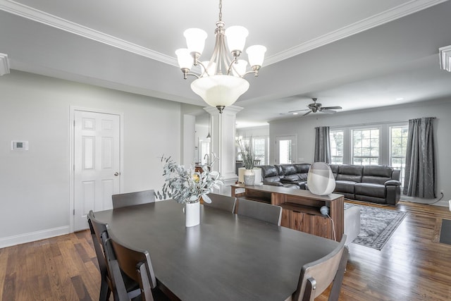 7531 Nightfall Cir, Ooltewah, TN 37363 - dining room featuring decorative columns, crown molding, dark wood-type flooring, a chandelier, and baseboards