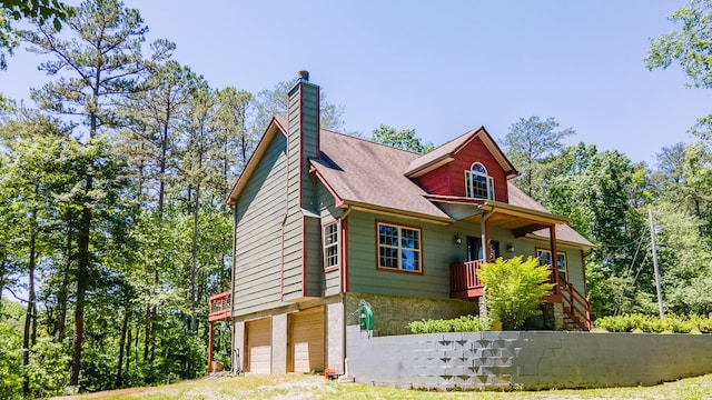 2217 Sr 399, Palmer, TN 37365 - view of front of house featuring an attached garage, a chimney, stairs, driveway, and roof with shingles