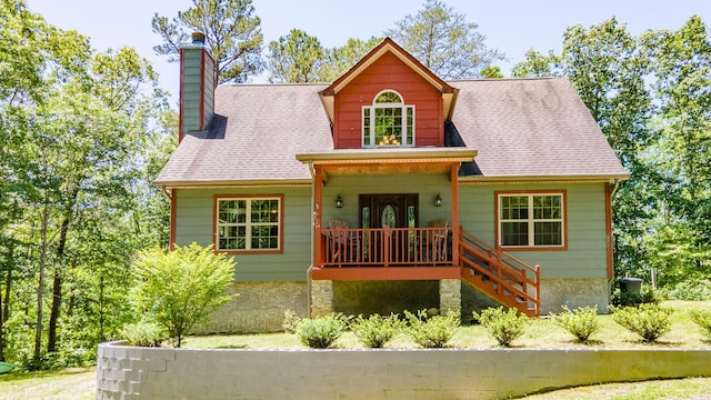 2217 Sr 399, Palmer, TN 37365 - view of front of home with a porch, a chimney, stairs, and roof with shingles