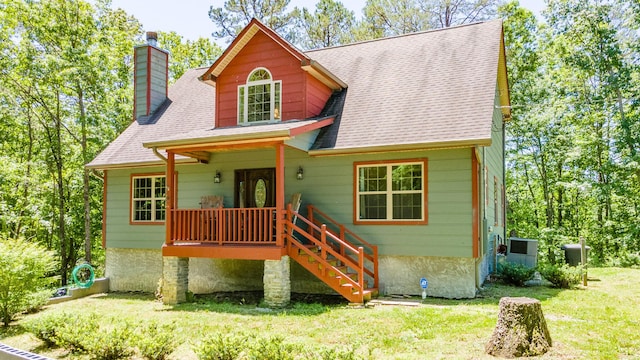 2217 Sr 399, Palmer, TN 37365 - view of front of home featuring a chimney, a front yard, a shingled roof, covered porch, and stairs