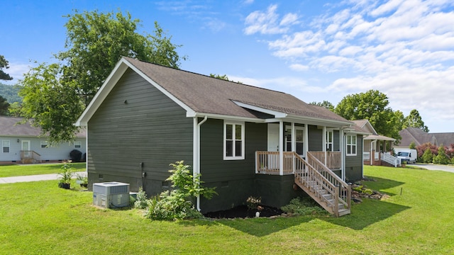 9503 Weidner Ln, Ooltewah, TN 37363 - view of front of property with crawl space, covered porch, central air condition unit, a front yard, and stairway