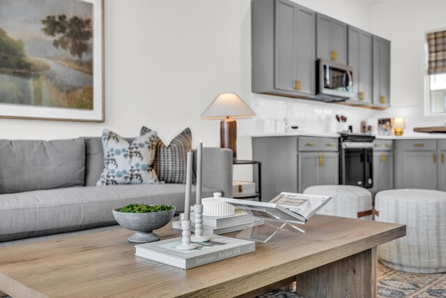 135 Peerless Ave Unit 120, Chattanooga, TN 37405 - kitchen with gray cabinetry, stainless steel microwave, and light countertops