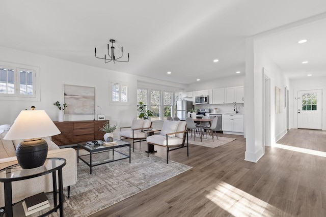 2806 N Chamberlain Ave, Chattanooga, TN 37406 - living room with wood finished floors, a chandelier, recessed lighting, and baseboards