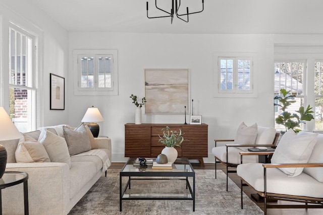 2806 N Chamberlain Ave, Chattanooga, TN 37406 - living room with a chandelier, wood finished floors, and baseboards