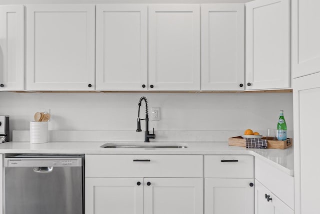2806 N Chamberlain Ave, Chattanooga, TN 37406 - kitchen featuring stainless steel dishwasher, a sink, light countertops, and white cabinetry