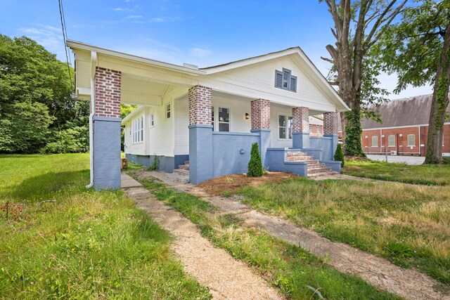 2806 N Chamberlain Ave, Chattanooga, TN 37406 - bungalow-style home with brick siding and covered porch