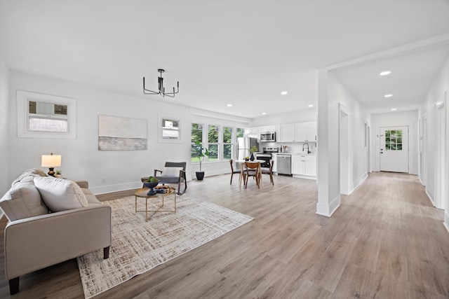 2806 N Chamberlain Ave, Chattanooga, TN 37406 - living area with healthy amount of natural light, light wood-type flooring, recessed lighting, and a chandelier