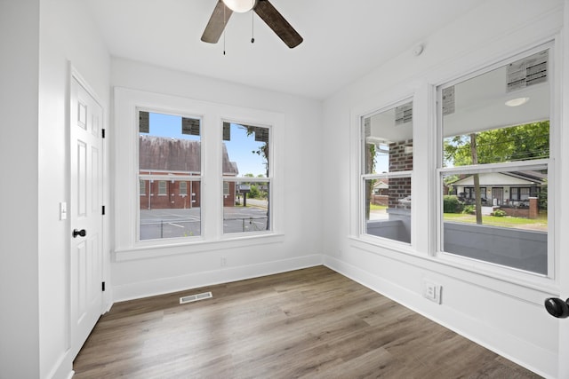 2806 N Chamberlain Ave, Chattanooga, TN 37406 - empty room featuring plenty of natural light, wood finished floors, and ceiling fan