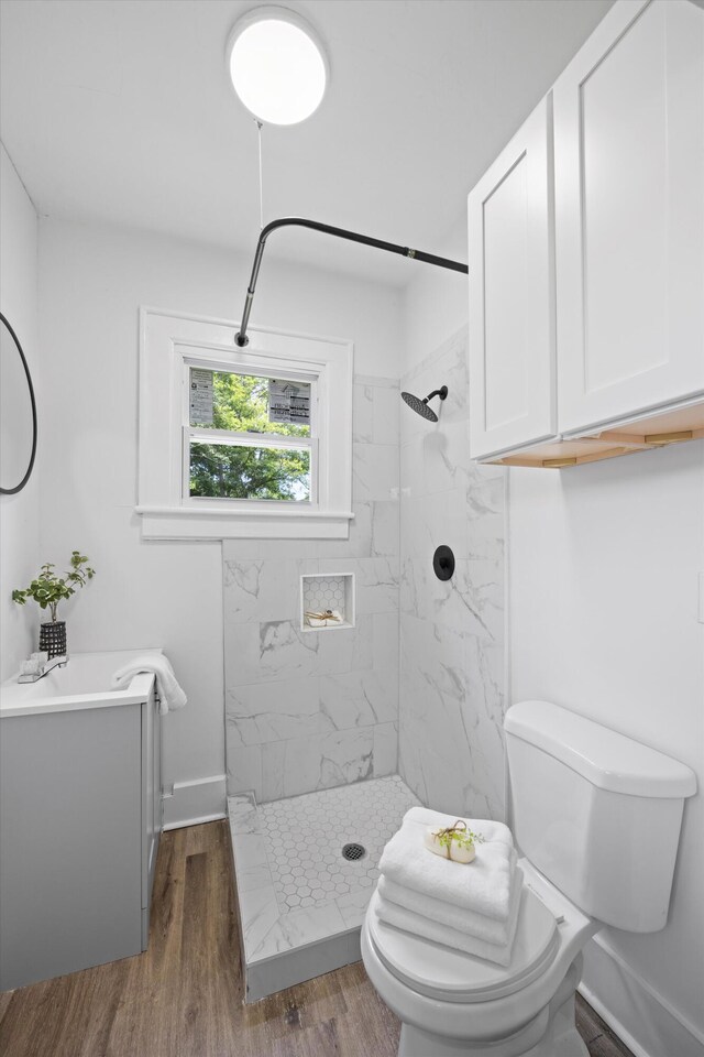 2806 N Chamberlain Ave, Chattanooga, TN 37406 - bathroom with a marble finish shower, wood finished floors, and vanity