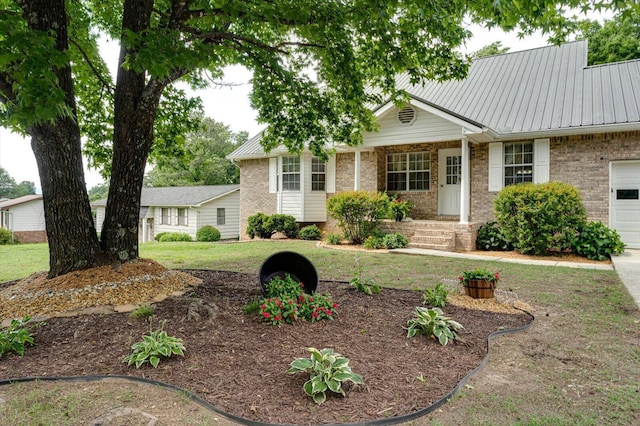 8719 Glenaire Dr, Chattanooga, TN 37416 - single story home with brick siding, metal roof, an attached garage, and a front yard