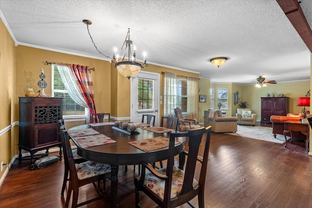 8719 Glenaire Dr, Chattanooga, TN 37416 - dining room with a textured ceiling, healthy amount of natural light, wood finished floors, ornamental molding, and a ceiling fan