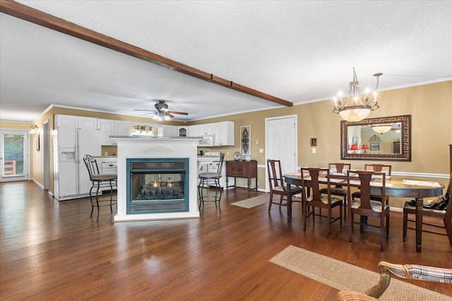 8719 Glenaire Dr, Chattanooga, TN 37416 - dining space featuring a textured ceiling, a multi sided fireplace, dark wood-style flooring, ceiling fan, and crown molding
